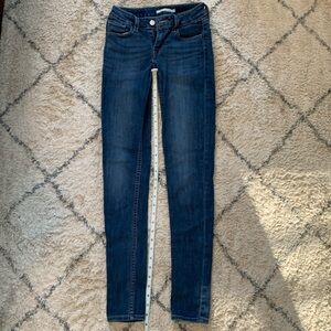 Levi’s 535 medium/ dark wash with no flaws.